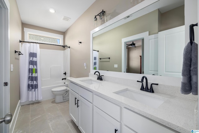 full bathroom with ceiling fan, vanity, shower / tub combo, and toilet