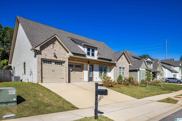 view of front of home featuring a front lawn, central AC unit, and a garage