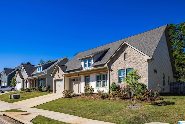 view of front of house featuring a garage and a front lawn