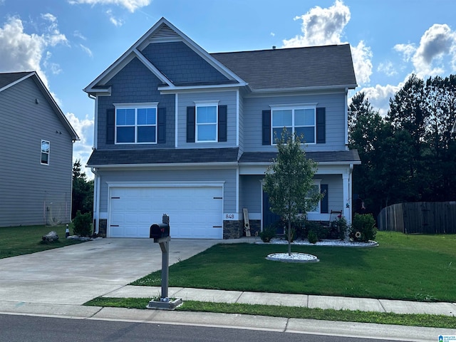 view of front of property with a garage and a front lawn