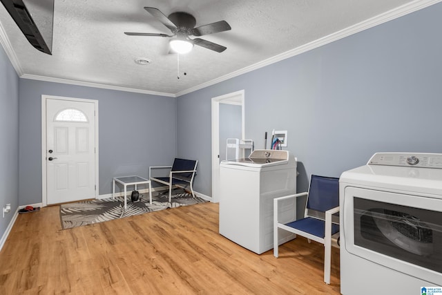 interior space featuring washer and clothes dryer, ornamental molding, hardwood / wood-style floors, and ceiling fan