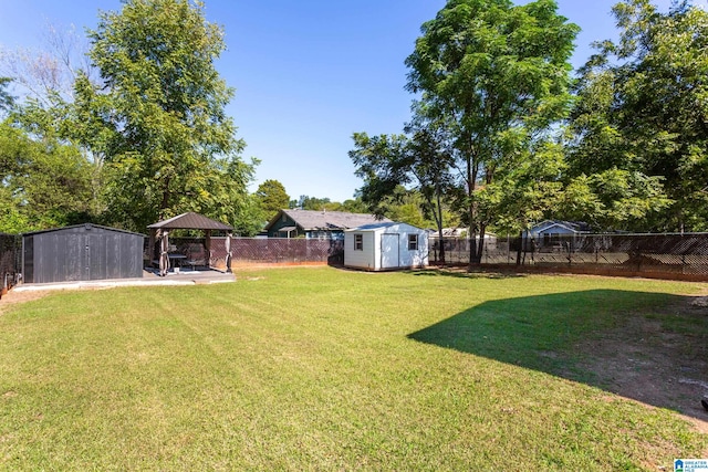 view of yard with a patio and a shed