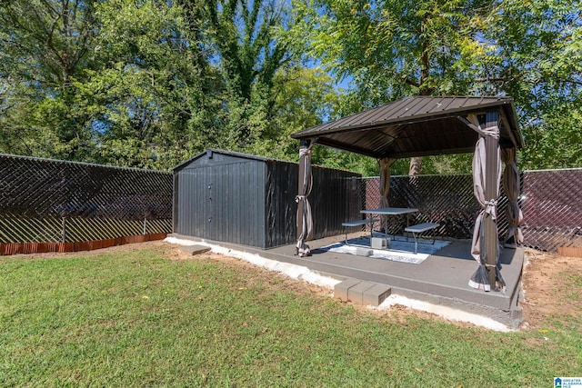 view of yard featuring a gazebo and a storage shed