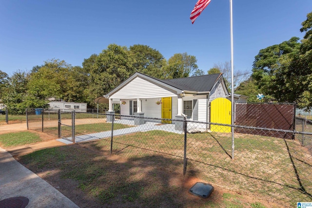 bungalow-style house with a front lawn