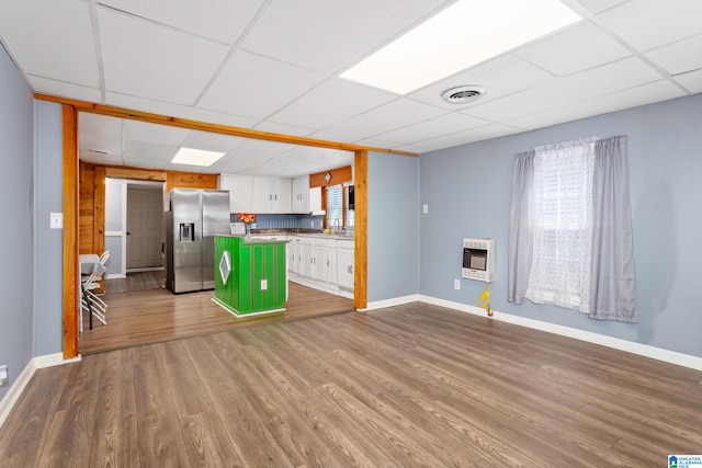 kitchen featuring a kitchen island, a paneled ceiling, light hardwood / wood-style floors, white cabinetry, and stainless steel refrigerator with ice dispenser