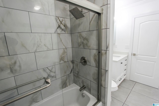 full bathroom featuring toilet, vanity, tile patterned floors, and tiled shower / bath