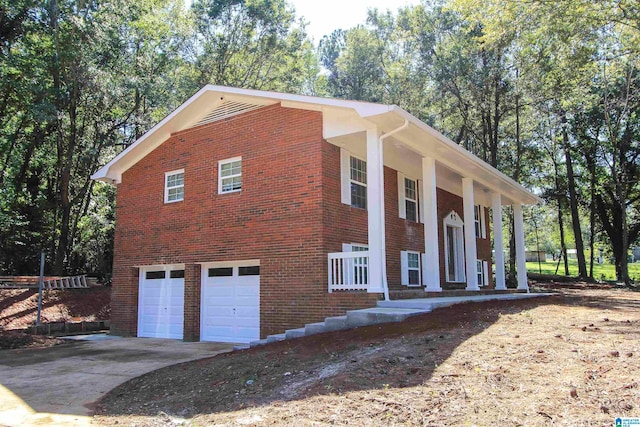 view of side of property with a garage