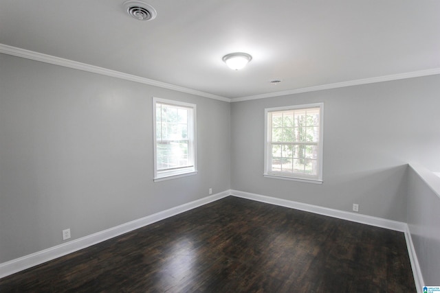 unfurnished room featuring crown molding and dark hardwood / wood-style flooring