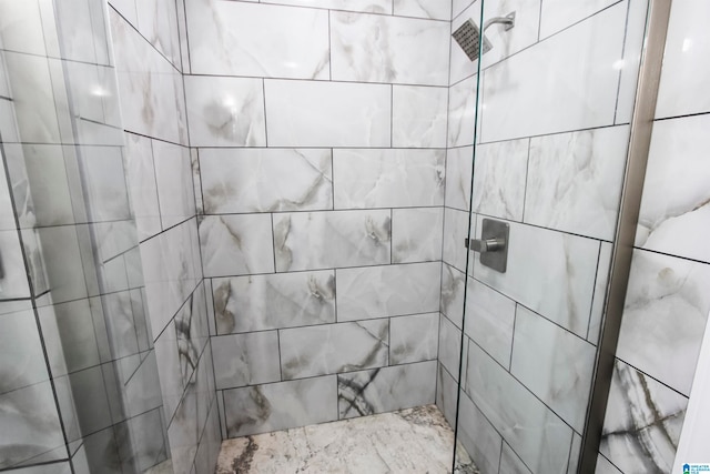 bathroom with tiled shower