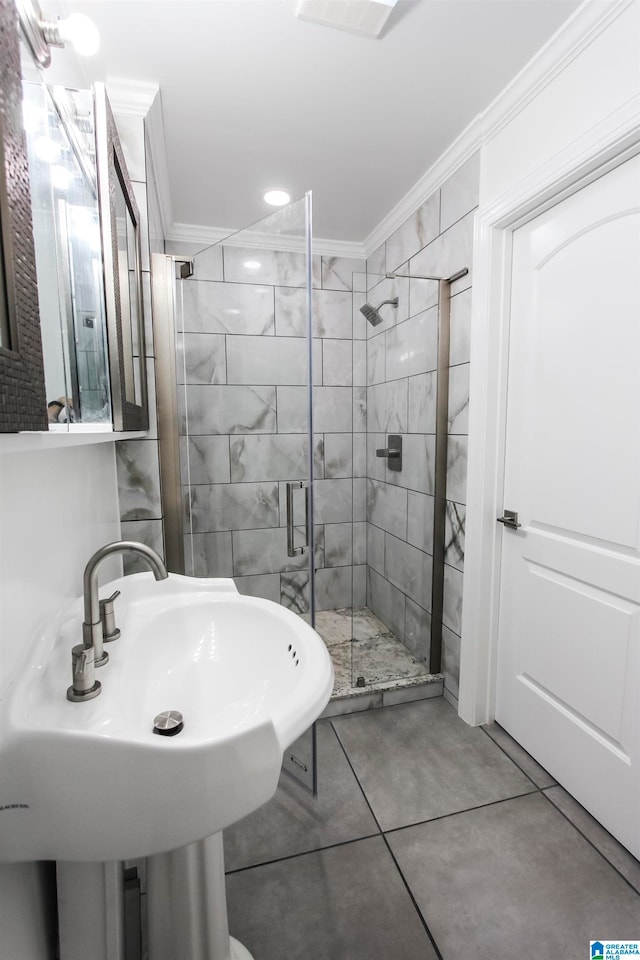 bathroom featuring sink, ornamental molding, and walk in shower