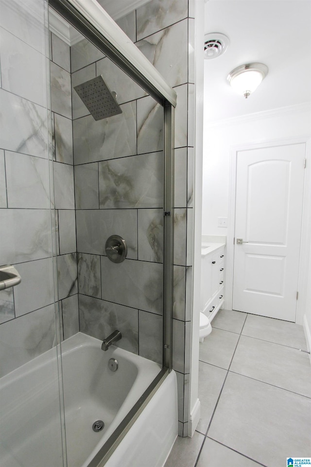 bathroom with vanity, tiled shower / bath combo, and tile patterned floors