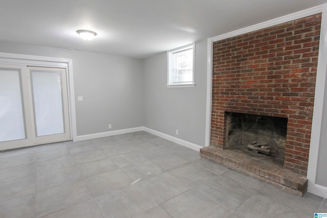 unfurnished living room with a brick fireplace