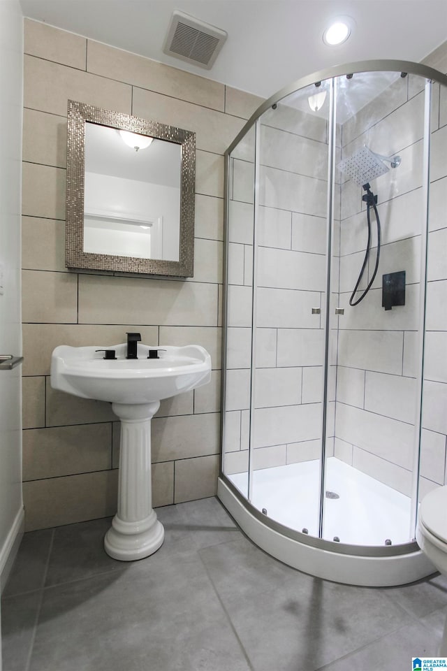 bathroom featuring concrete floors and an enclosed shower