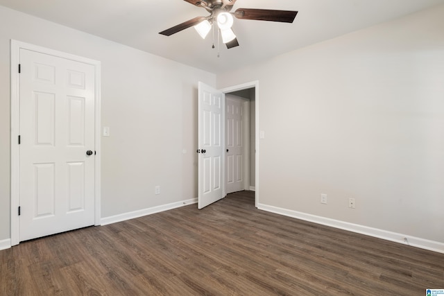 unfurnished bedroom with dark hardwood / wood-style floors and ceiling fan