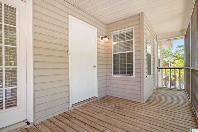 wooden deck featuring covered porch