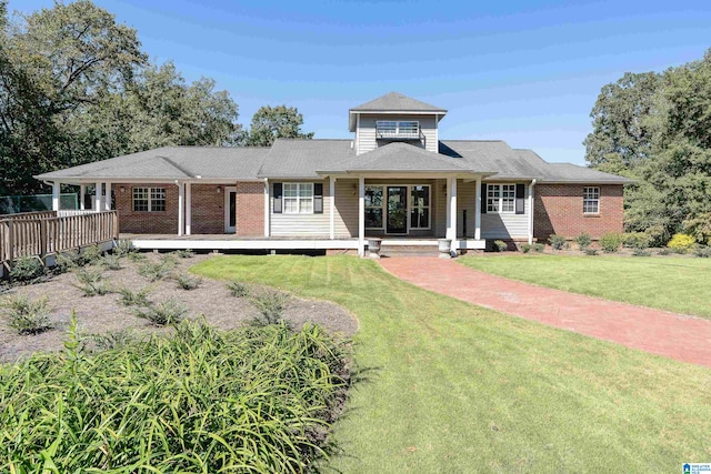 view of front facade with a porch and a front lawn