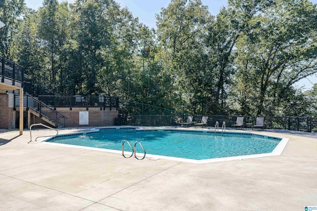 view of swimming pool featuring a patio