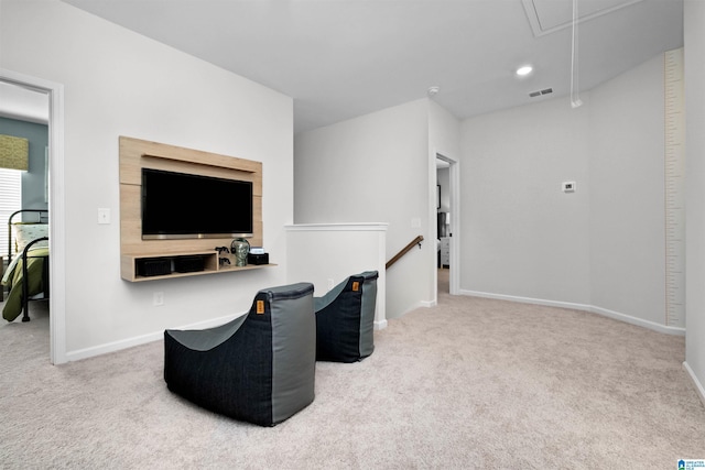 sitting room featuring carpet flooring