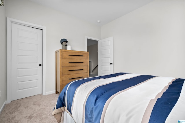 carpeted bedroom with a closet