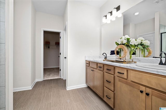 bathroom with vanity and an enclosed shower