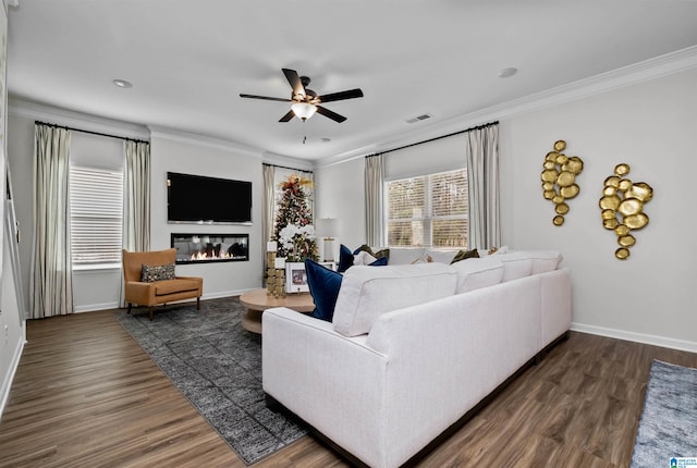 living room with ceiling fan, crown molding, and dark hardwood / wood-style flooring