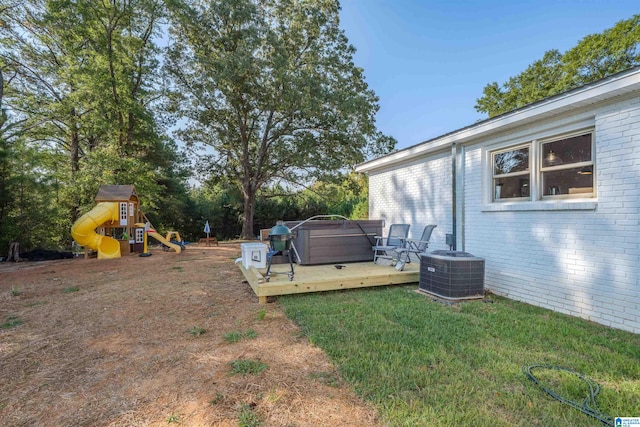 21023 Monroe Dunn Rd, Berry, AL 35546 - view of yard with a playground, a wooden deck, and central AC