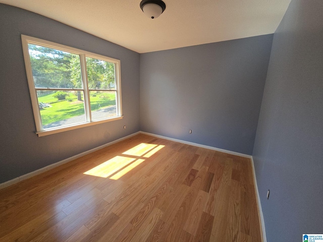 unfurnished room featuring hardwood / wood-style floors