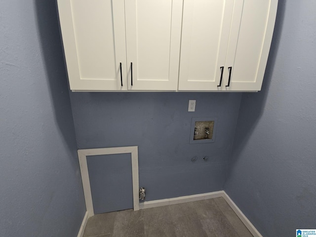 7301 6th Ave, Birmingham, AL 35206 - laundry area featuring hookup for a washing machine, baseboards, and cabinet space