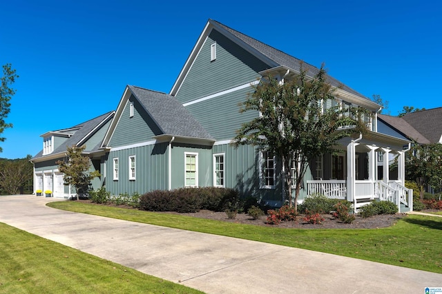 view of front of home with a porch and a front yard