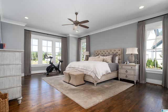 bedroom featuring crown molding, multiple windows, dark wood-type flooring, and ceiling fan