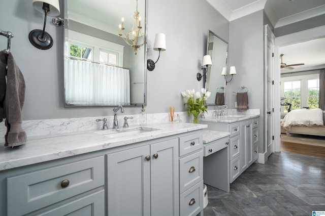 bathroom featuring vanity, ceiling fan, and crown molding