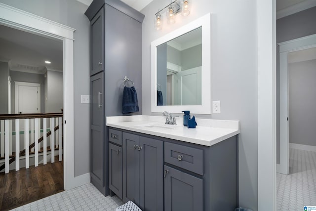 bathroom with vanity, tile patterned floors, and crown molding