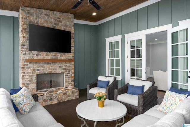 living room featuring hardwood / wood-style floors, ceiling fan, and wooden ceiling