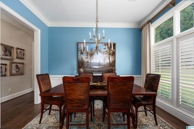 dining room with ornamental molding, dark wood-type flooring, and an inviting chandelier