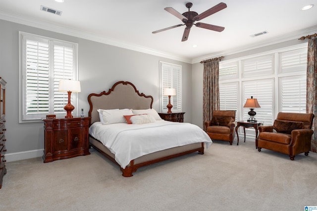 bedroom with ceiling fan, light colored carpet, and ornamental molding