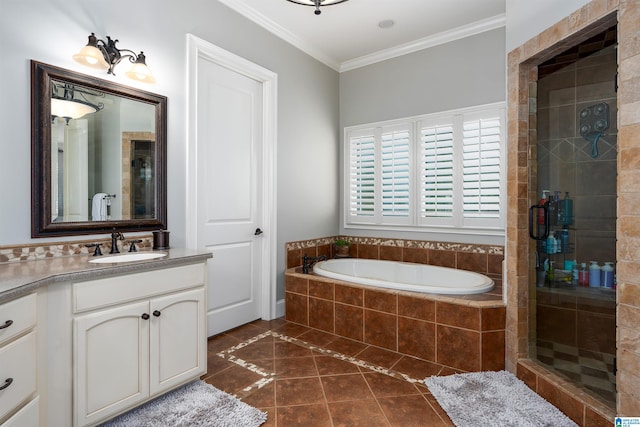 bathroom featuring independent shower and bath, vanity, crown molding, and tile patterned floors