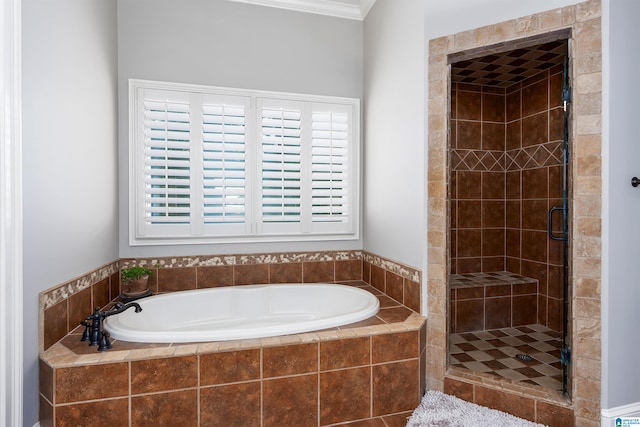 bathroom featuring shower with separate bathtub and crown molding