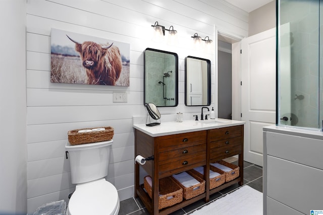 bathroom featuring toilet, tile patterned flooring, vanity, and walk in shower