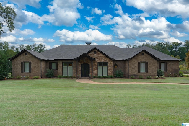 single story home featuring a front yard