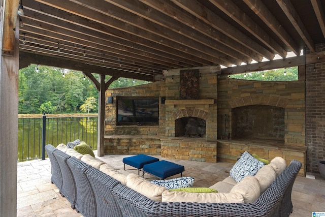 view of patio with an outdoor living space with a fireplace