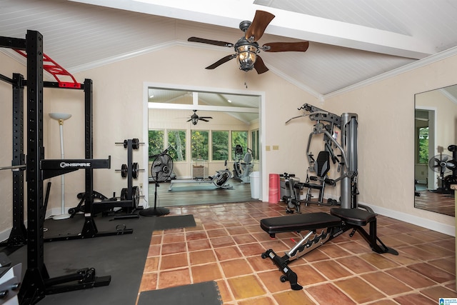 exercise room featuring ceiling fan, ornamental molding, tile patterned flooring, and vaulted ceiling