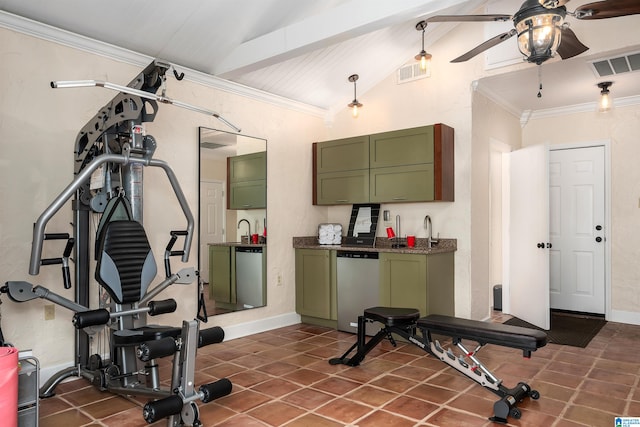 exercise room featuring ornamental molding, dark tile patterned floors, and vaulted ceiling