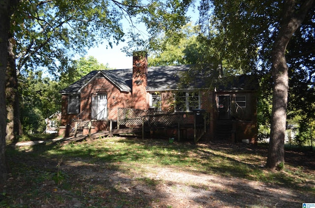 back of house featuring a wooden deck