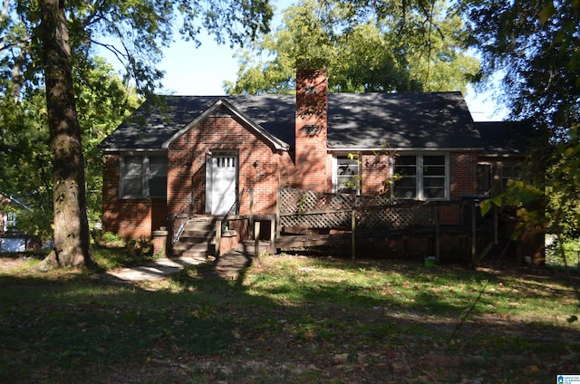 back of house featuring a yard and a deck