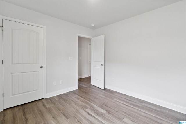 unfurnished bedroom with light wood-type flooring