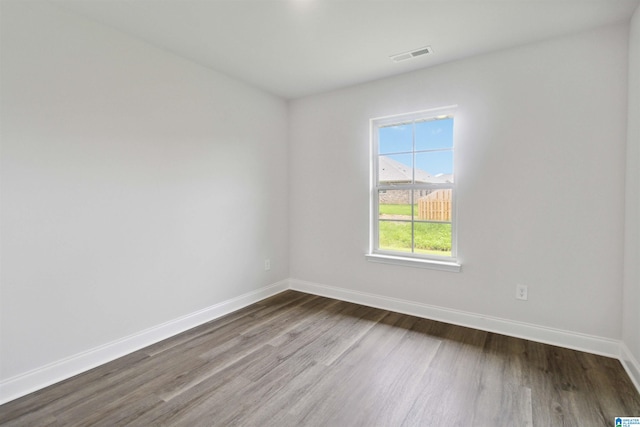 spare room with hardwood / wood-style flooring