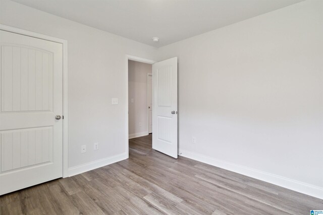 unfurnished bedroom with light wood-type flooring