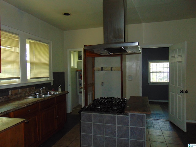 2820 20th St, Ensley, Birmingham, AL 35208 - kitchen with island exhaust hood, a sink, dark tile patterned floors, and black gas stovetop
