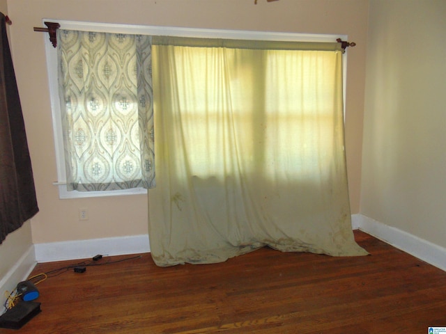 2820 20th St, Ensley, Birmingham, AL 35208 - empty room with wood finished floors, healthy amount of natural light, and baseboards