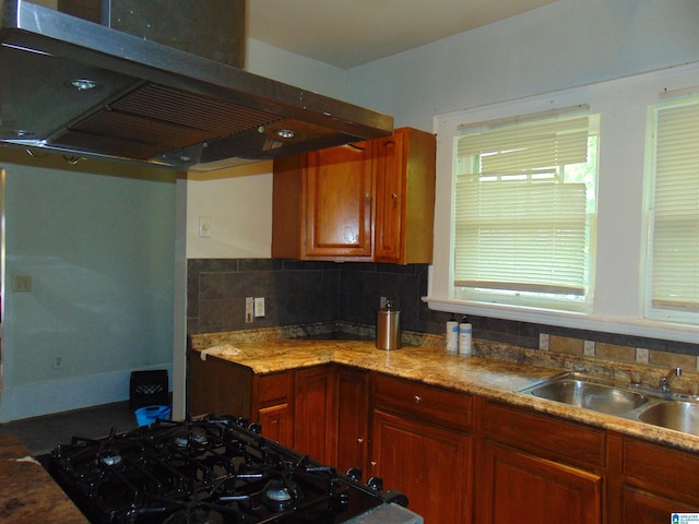 2820 20th St, Ensley, Birmingham, AL 35208 - kitchen with under cabinet range hood, a sink, backsplash, and light stone countertops